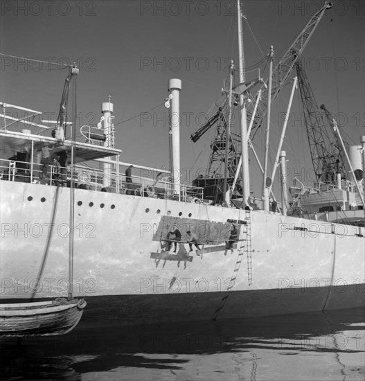 Painting the hull of a ship in the harbour of Gothenburg, Sweden, 1960. Artist: Torkel Lindeberg