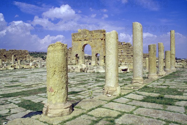 Antonine Gate and ruined pillars, Sbeitla, Tunisia.