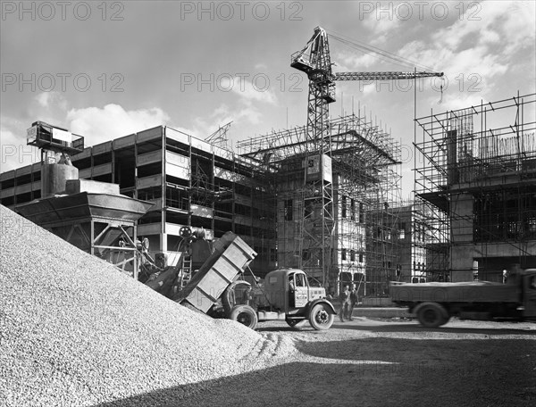 Early 1950s Bedford M Tipper delivering aggregates to a building site, South Yorkshire, July 1954. Artist: Michael Walters