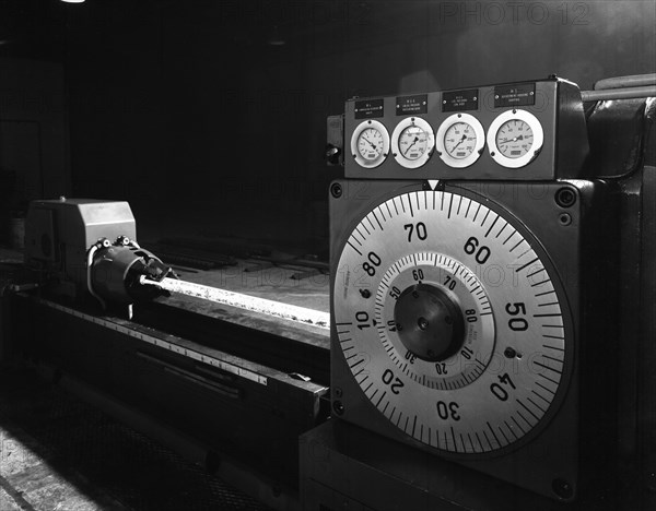 A continuous forge in operation at the Edgar Allen Steel Founders, Meadowhall, Sheffield, 1962.  Artist: Michael Walters