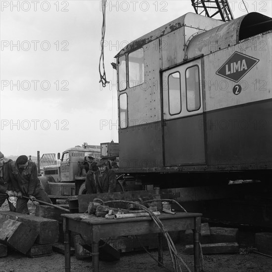 Early 1940s Diamond T truck pulling a large load, South Yorkshire, 1962. Artist: Michael Walters