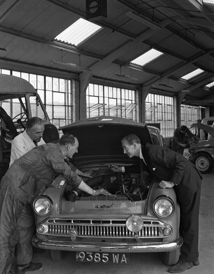 Automotive supplies representative with a 1960 Hillman Husky at a Sheffield Garage, 1963. Artist: Michael Walters