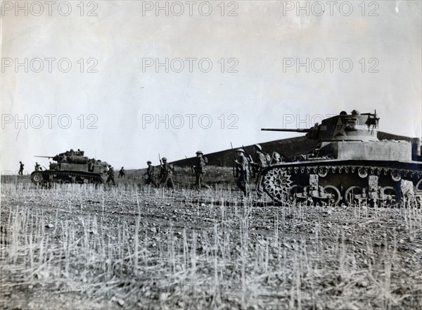 British troops supported by American tanks advance on the Tunisian front, December 1942. Artist: Unknown