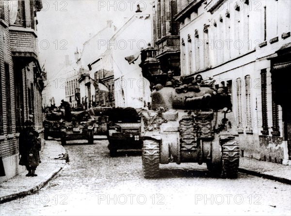 Polish tanks advance through the town of Tielt, Belgium, c1944. Artist: Unknown