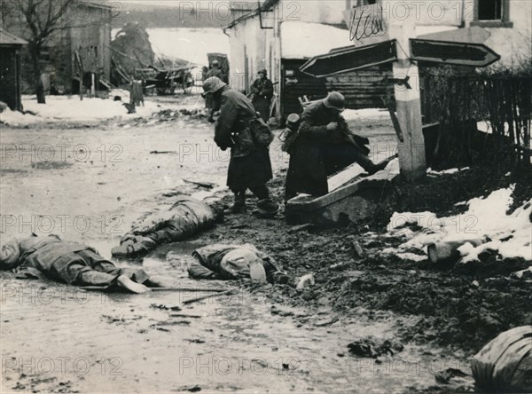 German troops stripping the equipment of dead American troops, Belgium. Artist: Unknown