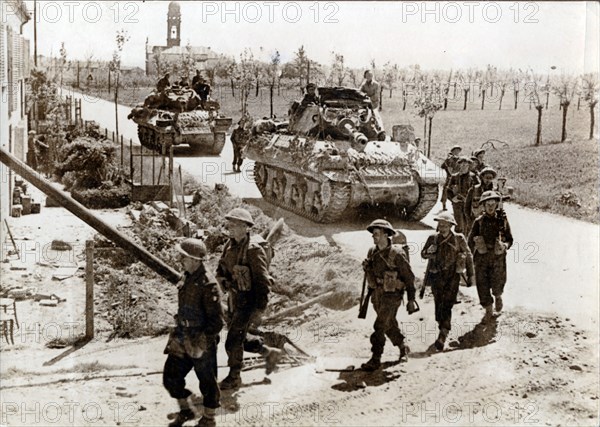 British 8th Army troops and tanks on the road to Ferrara, Italy, April 1945. Artist: Unknown