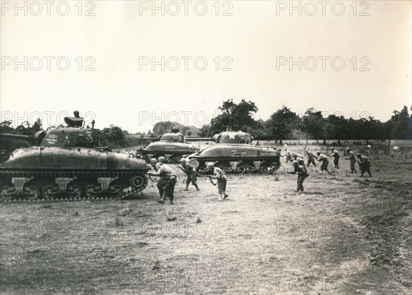 American tank and troops attack Périers, Normandy, July 1944. Artist: Unknown