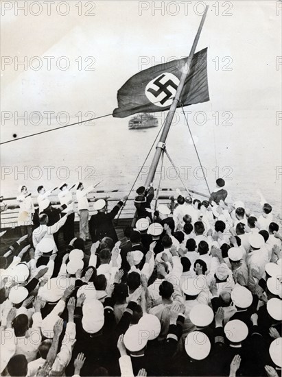 A salute to the Nazi party flag on the SS Bremen, New York, c1935. Artist: Unknown
