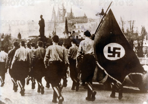 German troops enter Prague over the Charles Bridge, 15th March 1939. Artist: Unknown