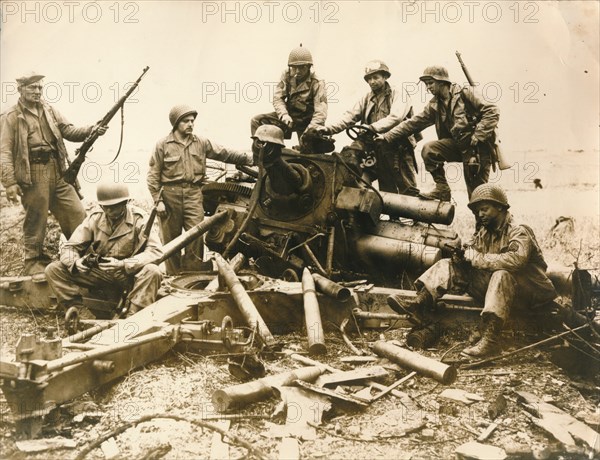 American troops looking for souvenir near Cherbourg airport, July 1944. Artist: Unknown