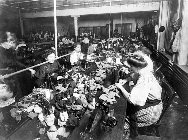 Women sewing teddy bears in a factory, c. 1915.