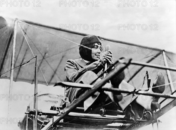 Hélène Dutrieu at the controls of her plane, c.1911.