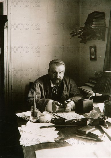 Alexander Kuprin, Russian author, at his desk, Gatchina, Russia, early 20th century. Artist: Karl Karlovich Bulla