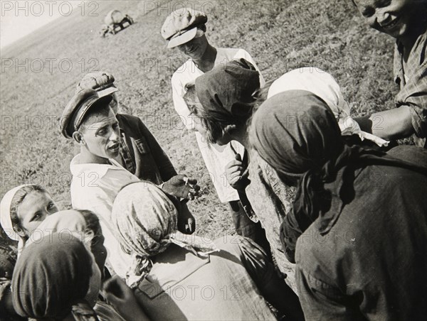 A Kolkhoz brigade taking a break, USSR, 1931. Artist: Anon