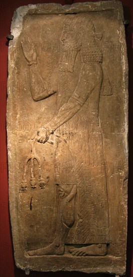 Priest with a branch of pomergranate tree. Detail of a relief from the palace of Assyrian king Sargon II, 722-705 BC. Artist: Assyrian Art