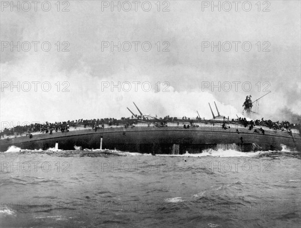 The german armoured cruiser SMS Blücher sinks after receiving multiple hits from British warships at Artist: Anonymous