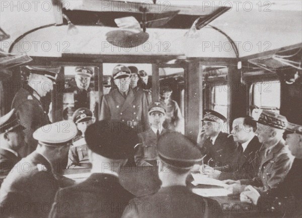 The German and French delegations inside a railroad car at Compiègne for the signing of France's sur Artist: Anonymous