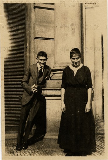 Franz Kafka with his sister Ottla before Oppelt House in Prague Artist: Anonymous