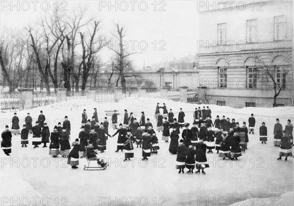 Pupils of the Smolny Institute for Noble Maidens at at Winter Walk, c. 1913. Artist: Bulla, Karl Karlovich (1853-1929)