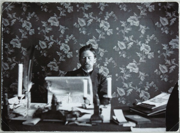 Anton Chekhov in his study in Yalta, 1895-1900. Artist: Anonymous