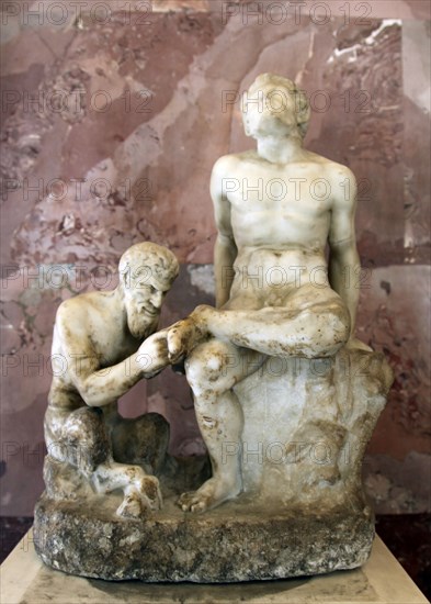 Pan and satyr, Pan removing a splinter from a satyr's foot. Artist: Unknown