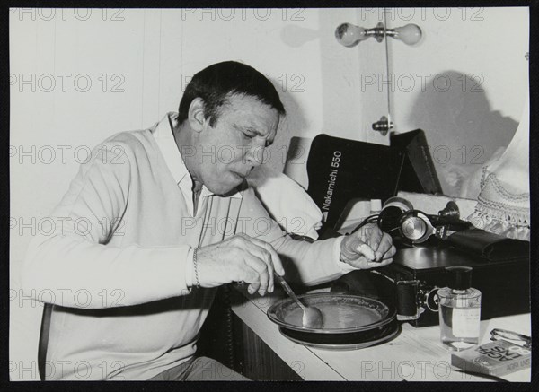 Buddy Rich eating backstage at Ronnie Scott's Jazz Club, London, 1979. Artist: Denis Williams