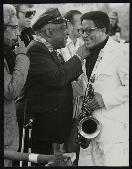 Count Basie chatting with Illinois Jacquet at the Capital Radio Jazz Festival, London, July 1979. Co Artist: Denis Williams