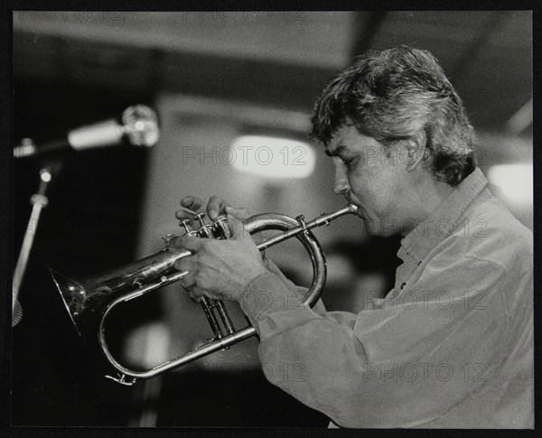 Dick Pearce playing the flugelhorn at The Fairway, Welwyn Garden City, Hertfordshire, 1999. Artist: Denis Williams