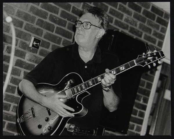 Jim Mullen playing guitar at The Fairway, Welwyn Garden City, Hertfordshire, 3 August 1997. Artist: Denis Williams