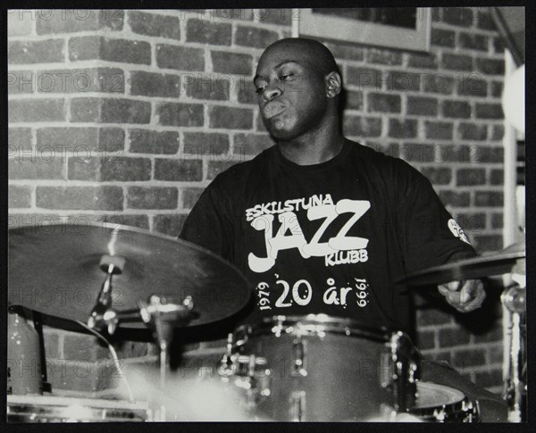 Winston Clifford on drums at The Fairway, Welwyn Garden City, Hertfordshire, 18 February 2001. Artist: Denis Williams