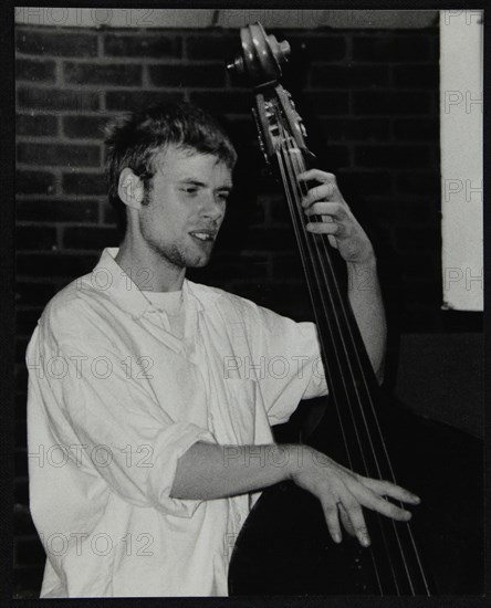 Bassist Ben Haselden playing at The Fairway, Welwyn Garden City, Hertfordshire, 8 April 2001. Artist: Denis Williams