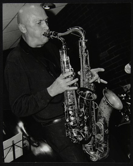 Kelvin Christiane playing two saxophones at The Fairway, Welwyn Garden City, Hertfordshire, 2002. Artist: Denis Williams