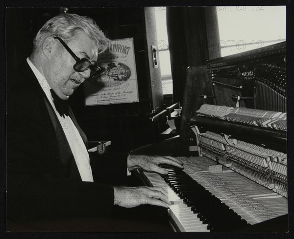 Nat Pierce at the piano, London, 1984. Artist: Denis Williams