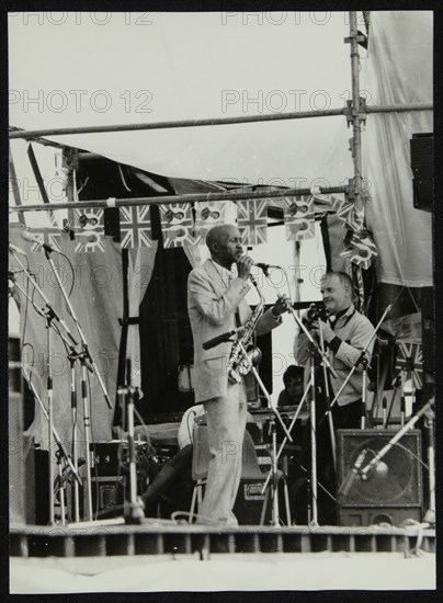 Denis Williams photographing Eddie 'Cleanhead' Vinson at Knebworth, Hertfordshire, 1981. Artist: Unknown