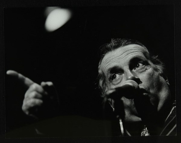 George Melly on stage at the Forum Theatre, Hatfield, Hertfordshire, 8 April 1983. Artist: Denis Williams