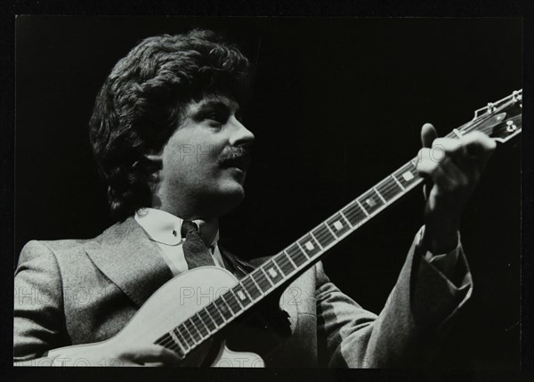 Guitarist Martin Taylor playing at the Forum Theatre, Hatfield, Hertfordshire, 1983. Artist: Denis Williams