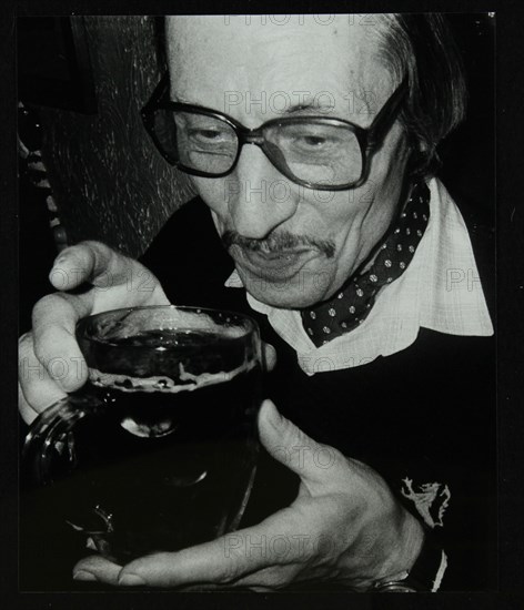 Tom Burnham with a pint at The Bell, Codicote, Hertfordshire, December 1986. Artist: Denis Williams