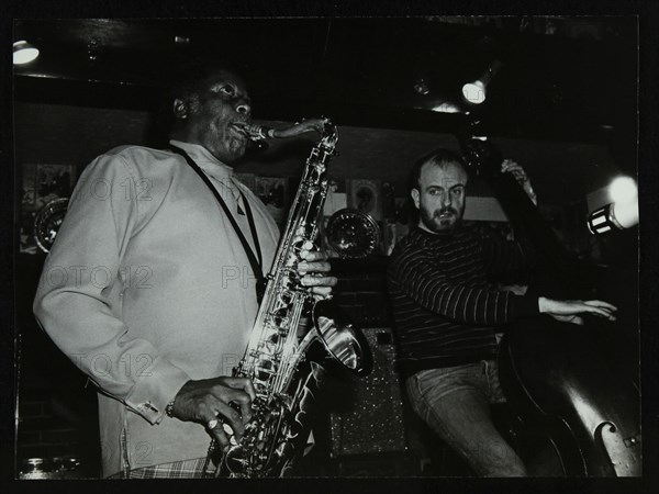 Eddie 'Lockjaw' Davis and Jim Richardson playing at The Bell, Codicote, Hertfordshire, 1982. Artist: Denis Williams