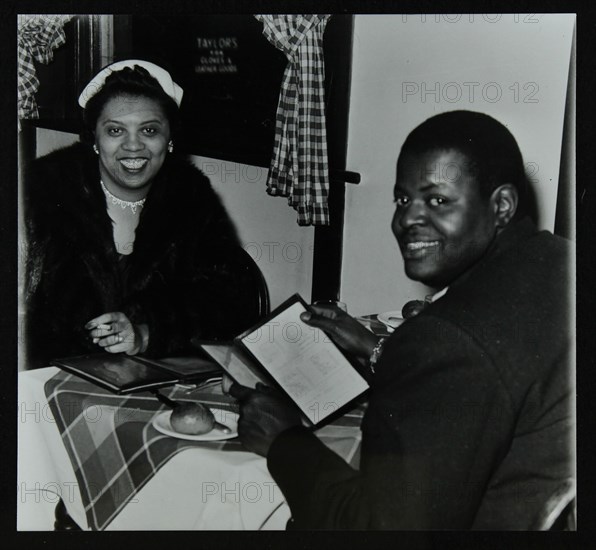 Oscar Peterson looking forward to dinner after a concert at Colston Hall, Bristol, 1955. Artist: Denis Williams