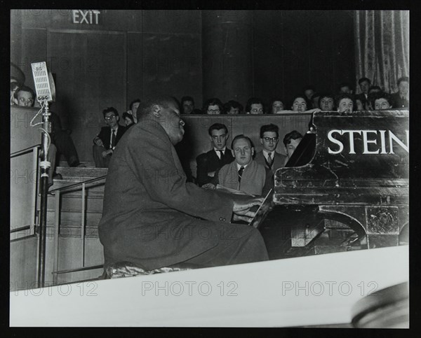 Oscar Peterson in concert at Colston Hall, Bristol, 1955. Artist: Denis Williams