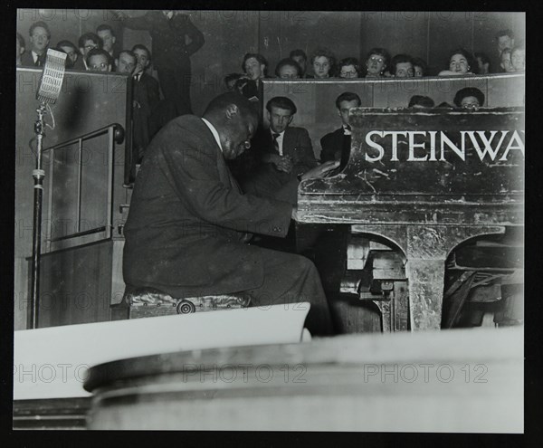 Oscar Peterson in concert at Colston Hall, Bristol, 1955. Artist: Denis Williams