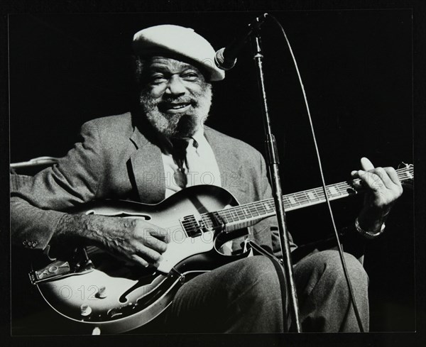 Slim Gaillard playing his guitar at the Forum Theatre, Hatfield, Hertfordshire, 13 November 1986. Artist: Denis Williams