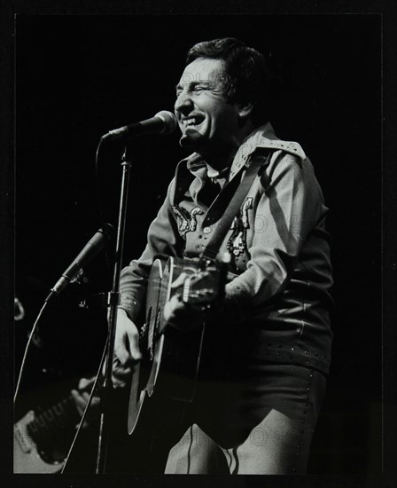 Lonnie Donegan on stage at the Forum Theatre, Hatfield, Hertfordshire, April 1979. Artist: Denis Williams