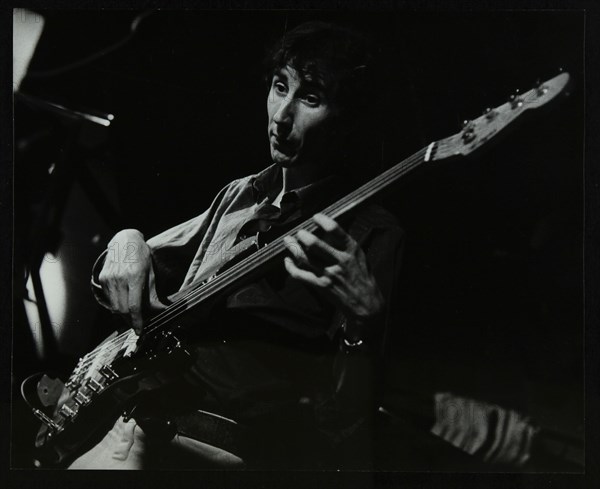 Steve Cook playing bass guitar at The Stables, Wavendon, Buckinghamshire. Artist: Denis Williams