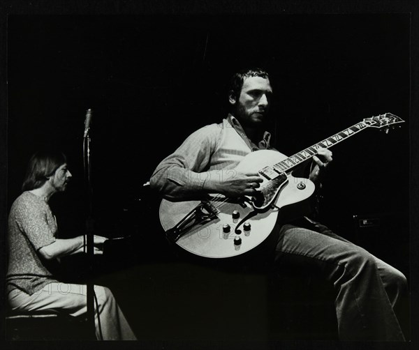 Phil Lee (guitar) and Michael Garrick (piano) playing at The Stables, Wavendon, Buckinghamshire. Artist: Denis Williams