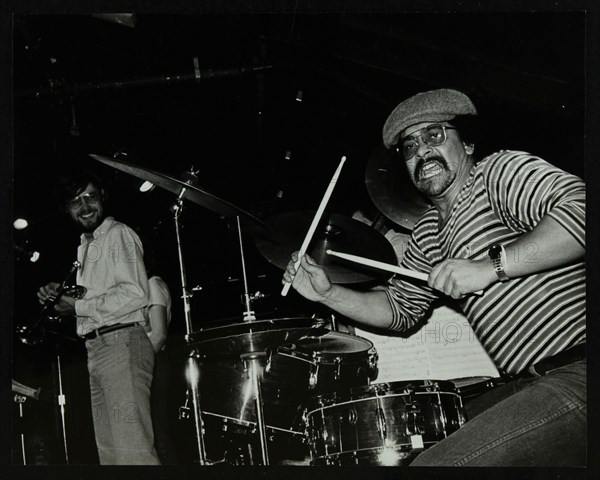 Brian Abrahams (drums) and Guy Barker (trumpet) on stage at The Stables, Wavendon, Buckinghamshire. Artist: Denis Williams