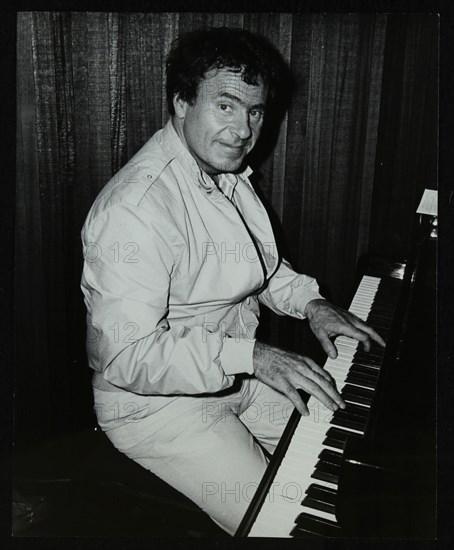 American trombonist and teacher Phil Wilson playing the piano, London, 1985. Artist: Denis Williams