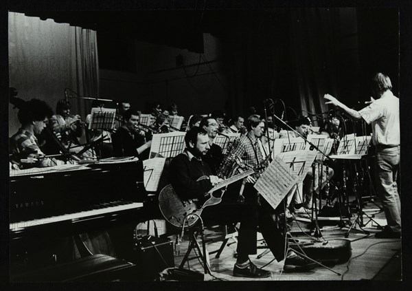 Michael Garrick conducting an orchestra at Berkhamsted Civic Centre, 1985. Artist: Denis Williams