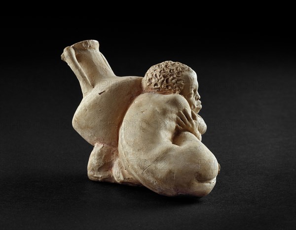 Terracotta figurine of an Afro-Hellenic boy, possibly a slave with Rhodian amphora, 4th century BC. Artist: Unknown.