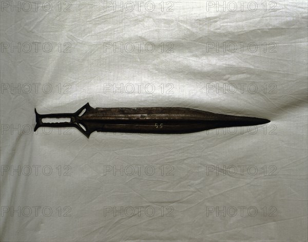 Sword of three parts barb, carp's tongue shaped blade, from Palma del Rio (Cordoba).